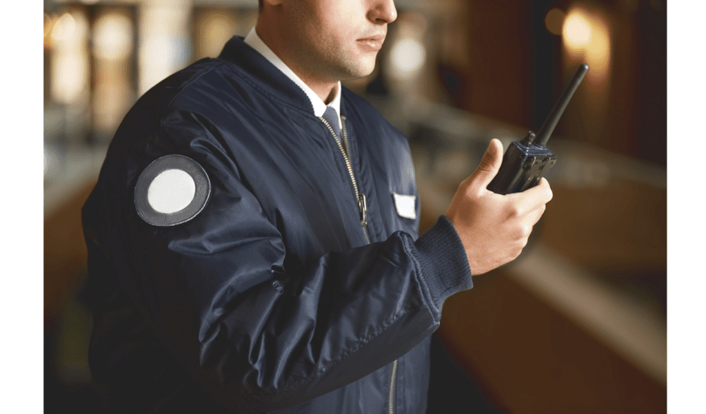 security guard holding walkie talkie